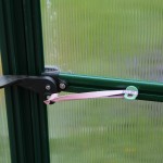 A hanging plant hook (optional accessory) is a convenient place to hook a spring or rubber band to prevent winds from lifting the door latch.