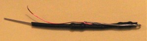 String of low-valued resistors insulated with black heatshrink